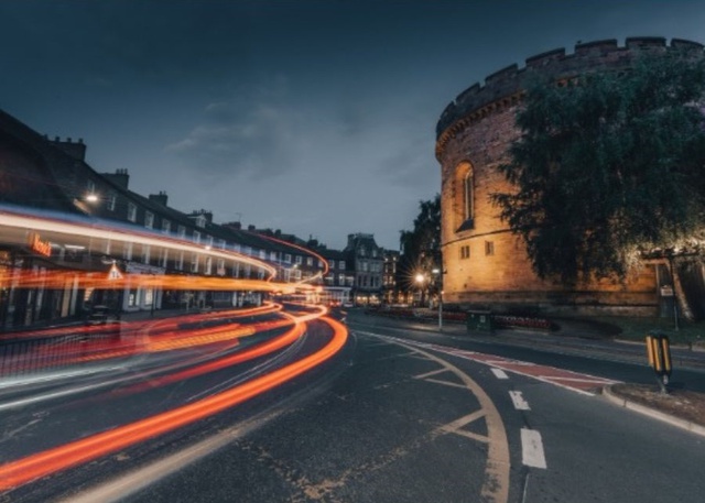 A long exposure shot of Carlisle at night, lights are blurred