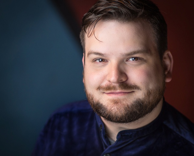 A close up of David Ralph's smiling face, looking right at the camera