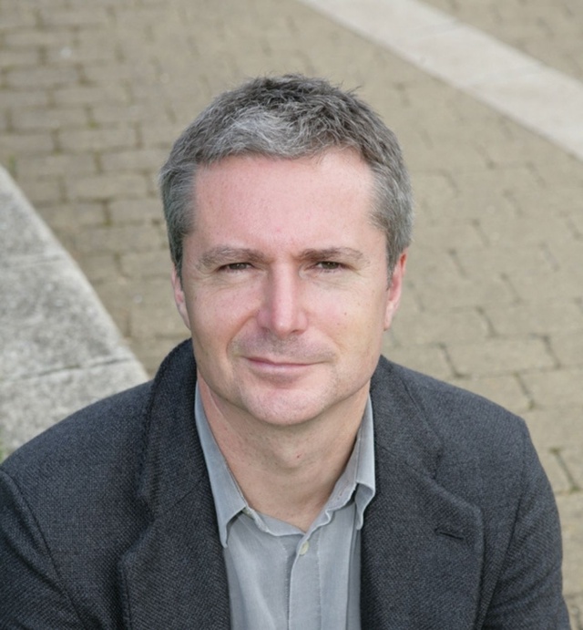 Headshot of Steven Fielding wearing a shirt and suit jacket