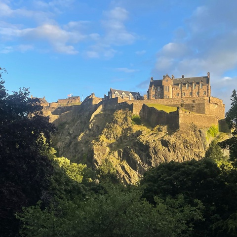 A sunny view of Edinburgh Castle taken from a distance away